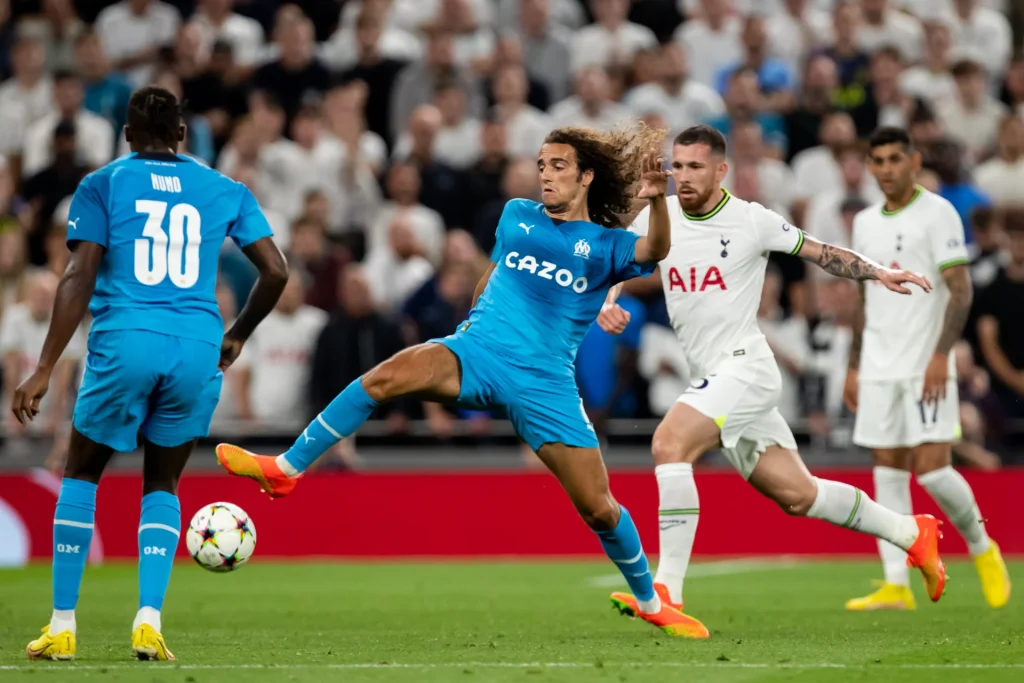 Guendouzi challenges for the ball in the Champions League game against Tottenham last week.