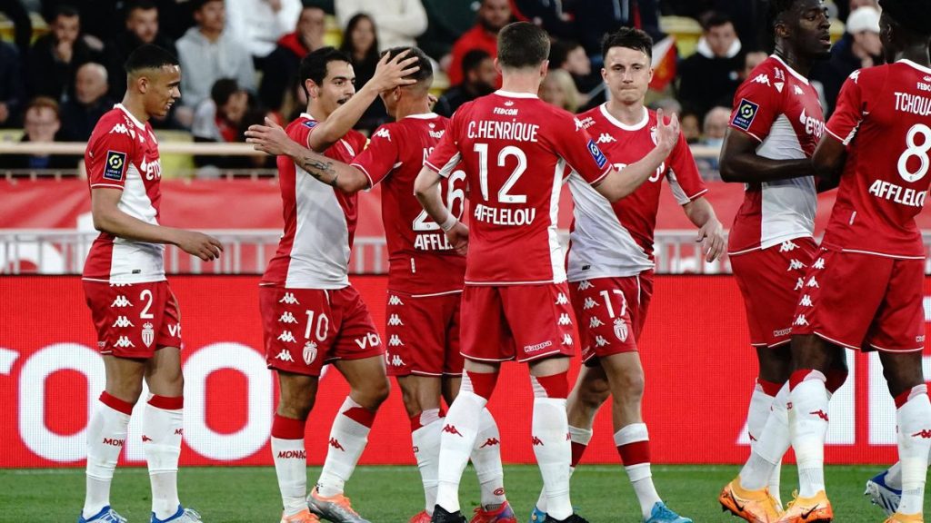 Monaco's players celebrate a goal in Ligue 1